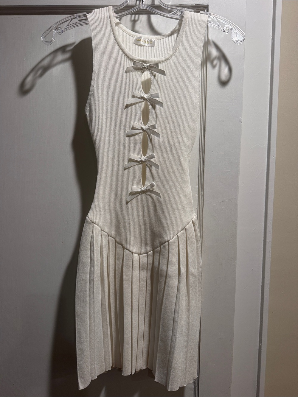 Sleeveless Cream Bow-Front Pleated Knit Dress